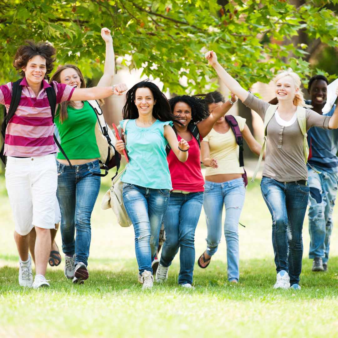Image of teens being happy and running