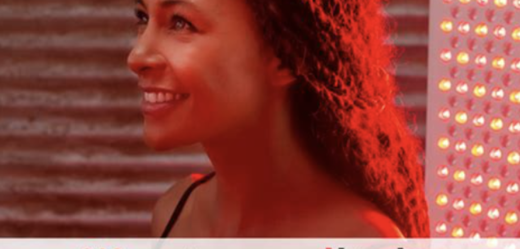 Mito Red Light. Image of a woman looking sideways, wearing a black tank top with curly hair smiling