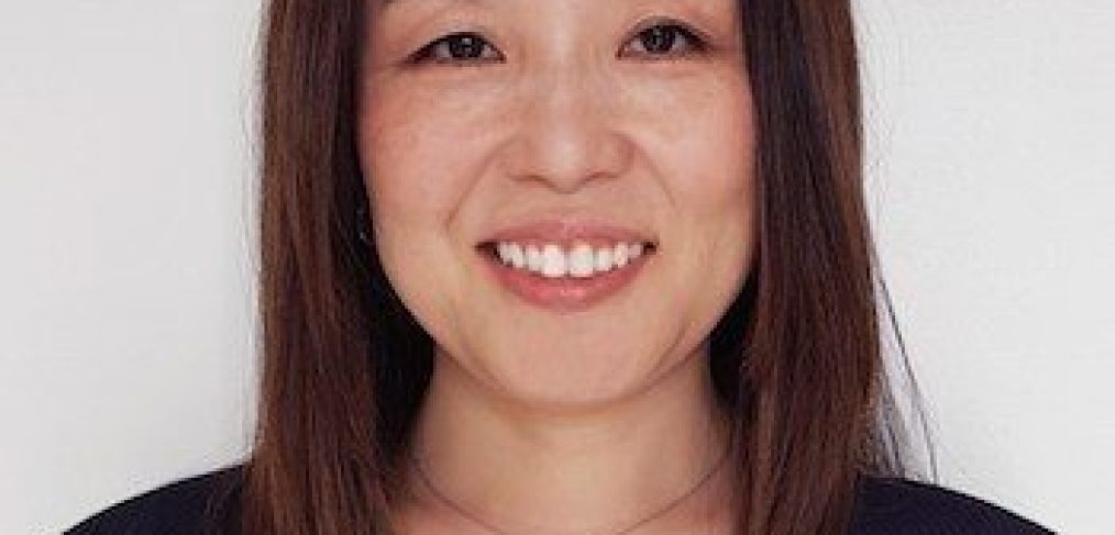 Miyuki Ono - woman with brown hair until collarbone, wearing navy blue blouse smiling
