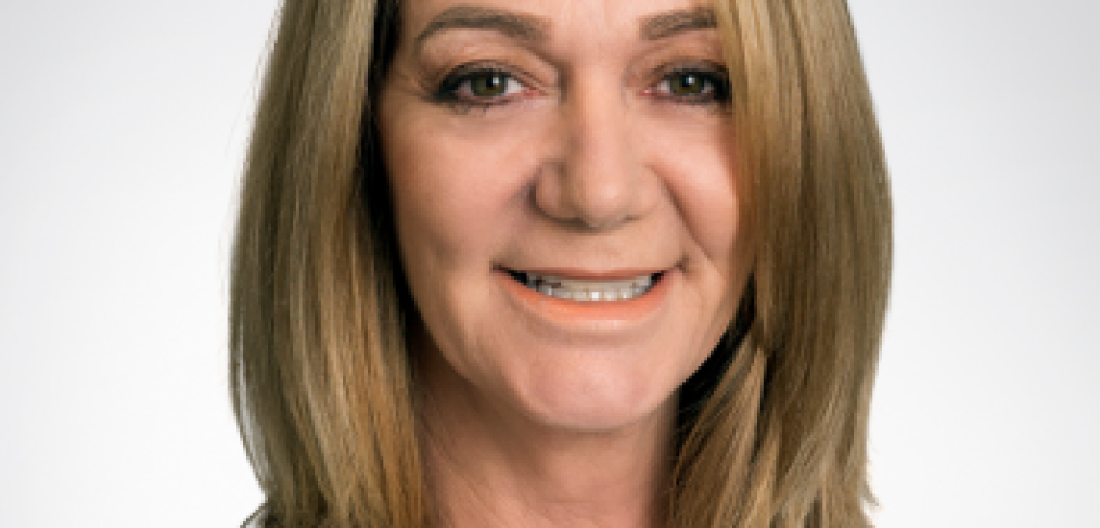 Brisbane City Psychologist Dr Jane Austin - woman wearing white shirt, blonde hair up to neck, smiling